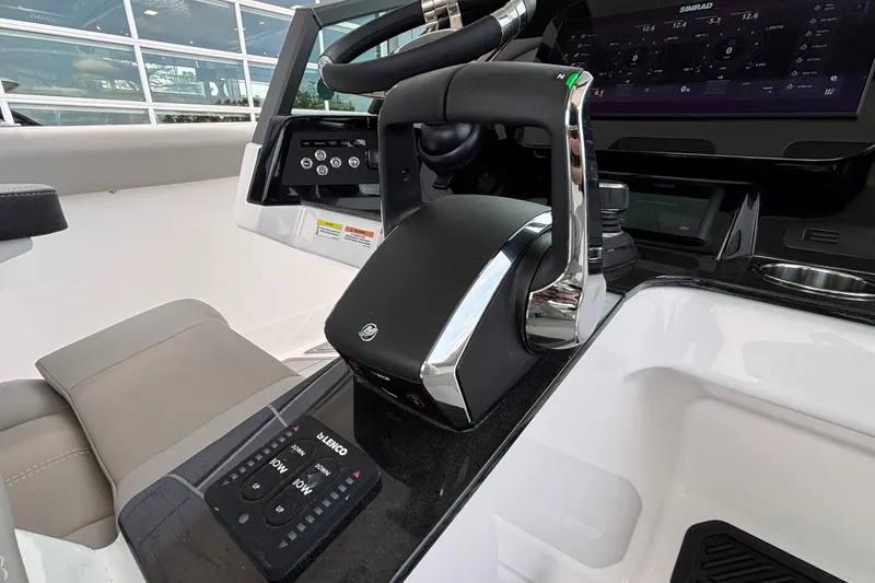 Slide: The Image of 2026 Monterey Elite 30 OB boat cockpit with modern controls and steering wheel. - 48