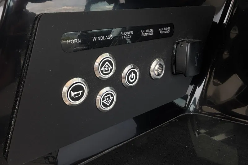 Slide: The Image of Control panel of 2026 Monterey Elite 30 OB boat with labeled buttons. - 51