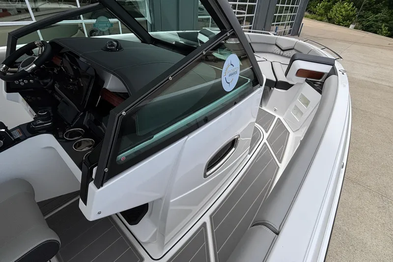 Slide: The Image of 2026 Monterey Elite 30 OB boat interior with sleek design and modern dashboard. - 54
