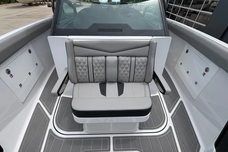 Slide: The Image of 2026 Monterey Elite 30 OB boat interior with stylish gray seating and modern design. - 60