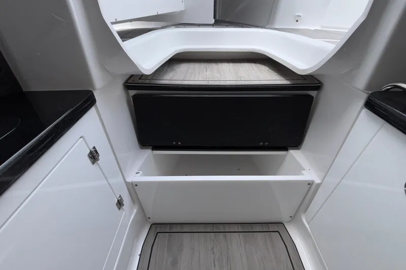 Slide: The Image of Interior of 2026 Monterey Elite 30 OB boat, featuring sleek cabinetry and modern design. - 72