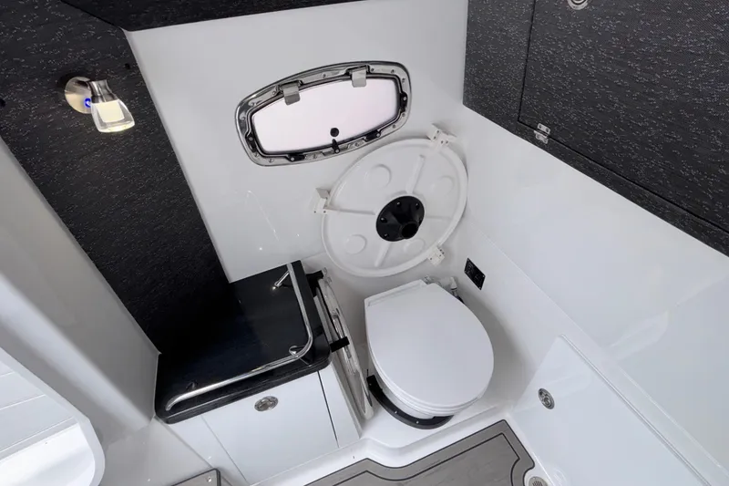Slide: The Image of Modern bathroom interior of 2026 Monterey Elite 30 OB boat, featuring sleek design and compact amenities. - 75