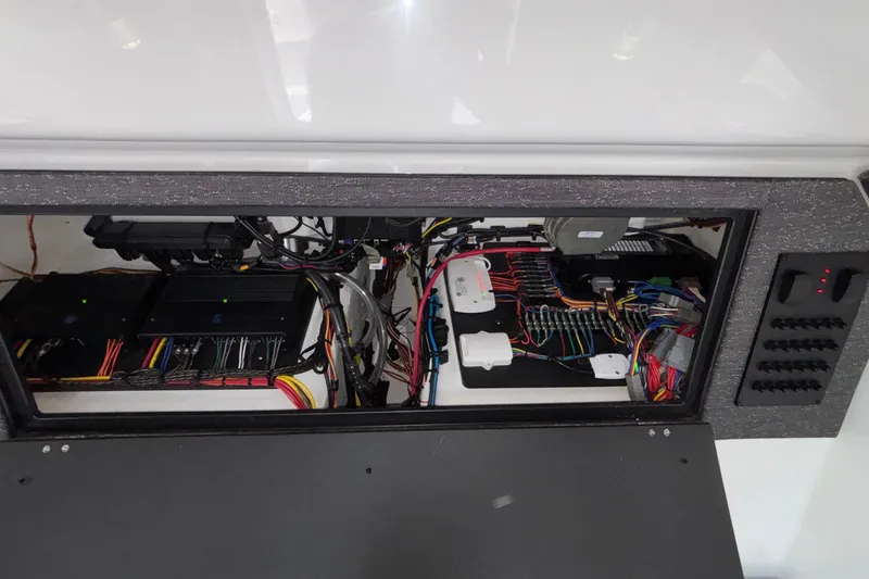 Slide: The Image of Electrical panel of 2026 Monterey Elite 30 OB boat, showcasing wiring and components. - 77