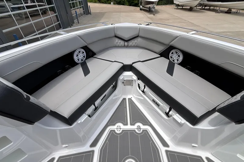 Slide: The Image of Luxurious seating area on the 2026 Monterey Elite 30 OB boat, featuring sleek design and speakers. - 80
