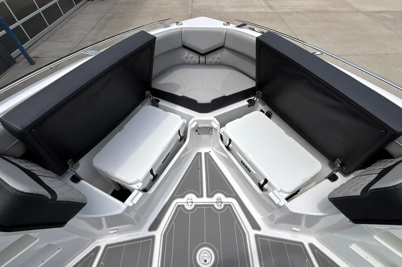 Slide: The Image of Interior view of 2026 Monterey Elite 30 OB boat with seating and storage compartments. - 83