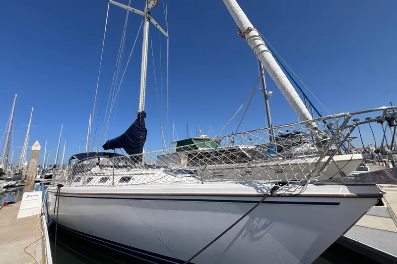 The Image of Sailboat docked at marina, Catalina 42 model, 1990, under clear blue sky. - 0