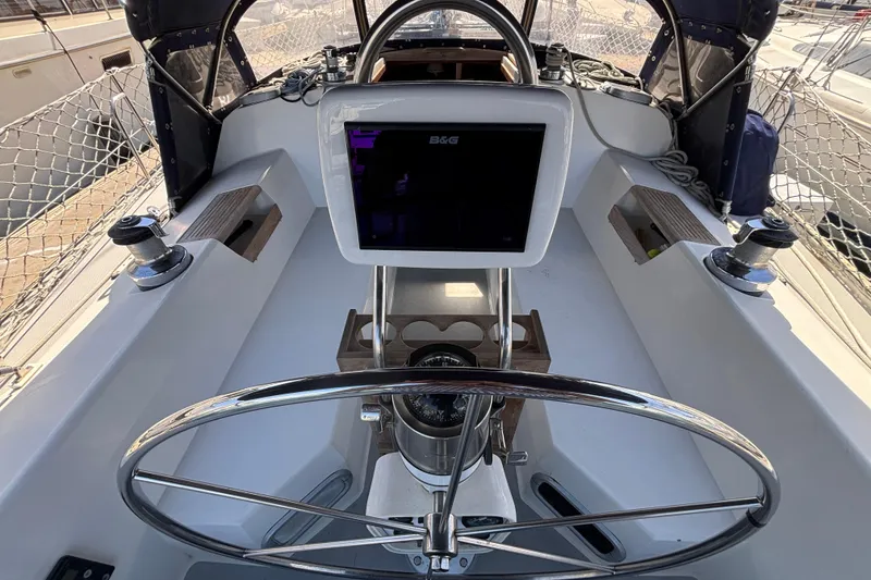 Slide: The Image of Cockpit of 1990 Catalina 42 sailboat with steering wheel and navigation equipment. - 10