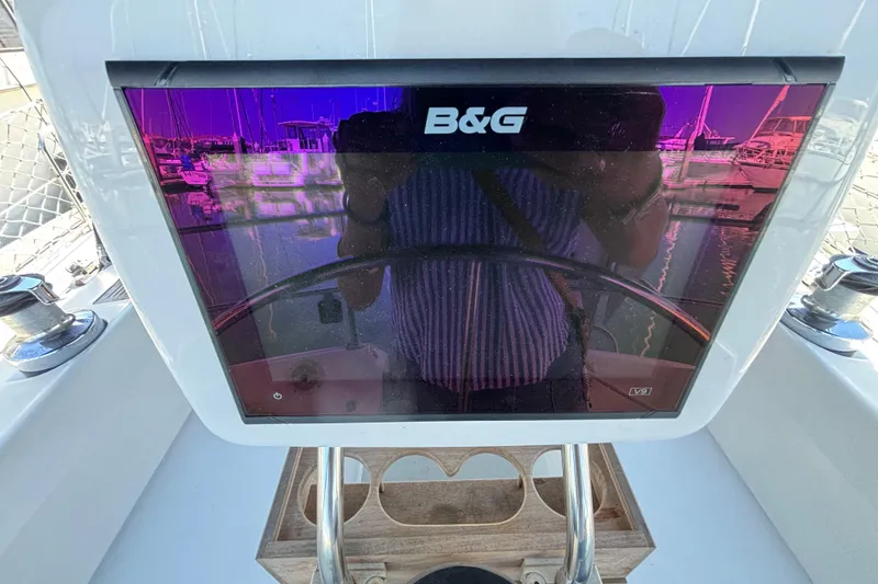 Slide: The Image of B&G navigation display on a 1990 Catalina 42 sailboat, reflecting marina scenery. - 11