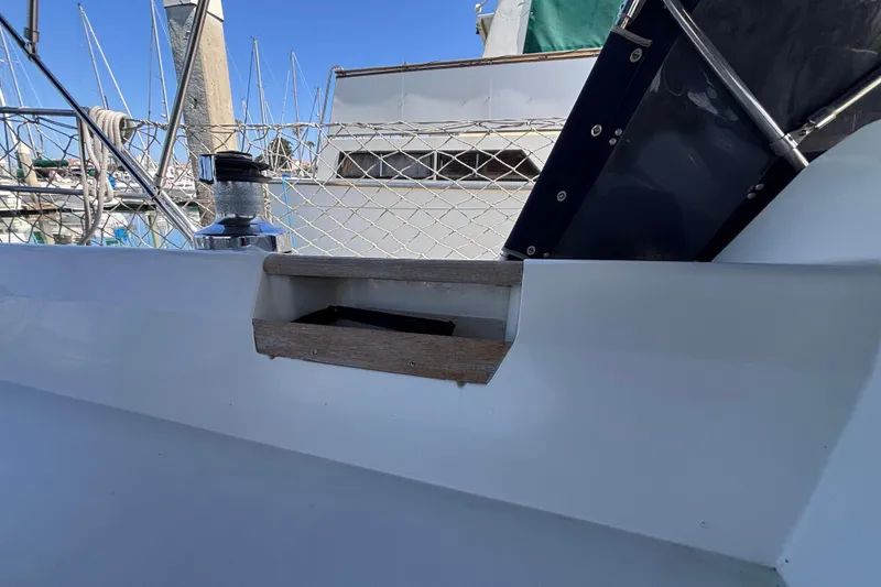 Slide: The Image of Sailboat deck detail of a 1990 Catalina 42, featuring winch and railing. - 13