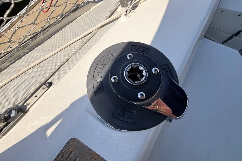 Slide: The Image of Winch on 1990 Catalina 42 sailboat deck, featuring Lewmar brand. - 15