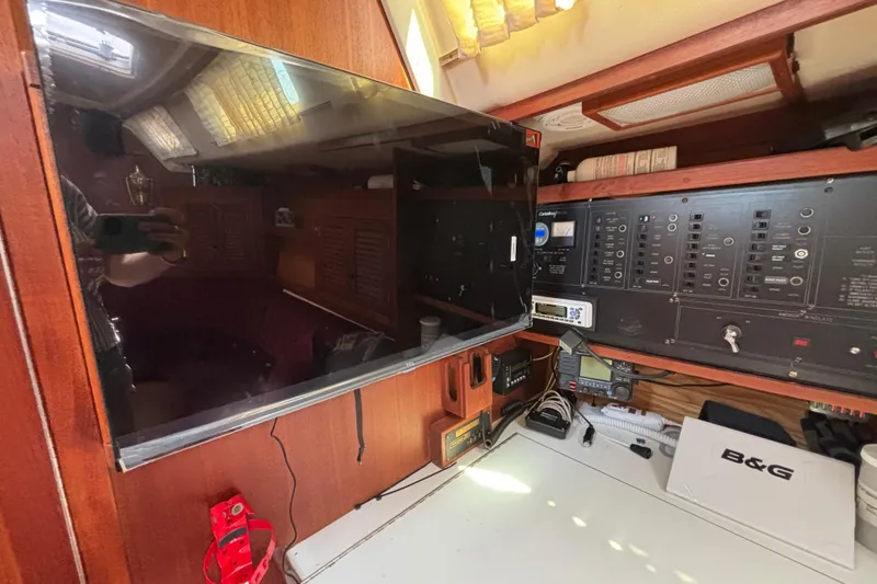 Slide: The Image of Interior of a 1990 Catalina 42 sailboat with navigation equipment and control panel. - 31