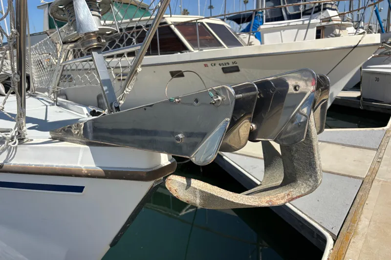 Slide: The Image of Bow of 1990 Catalina 42 sailboat with anchor and chain at marina. - 7
