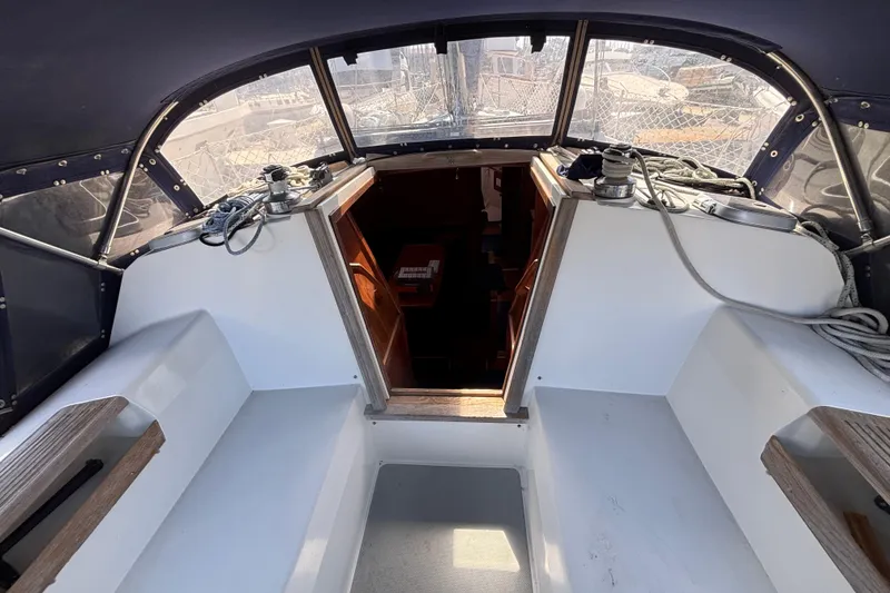 Slide: The Image of Cockpit of a 1990 Catalina 42 sailboat with ropes and winches. - 9