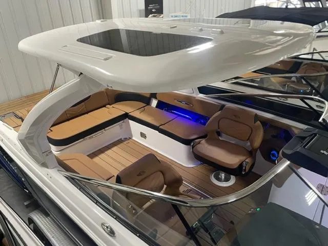 Slide: The Image of 2023 Chaparral 307 SSX boat with spacious seating and modern design. - 13