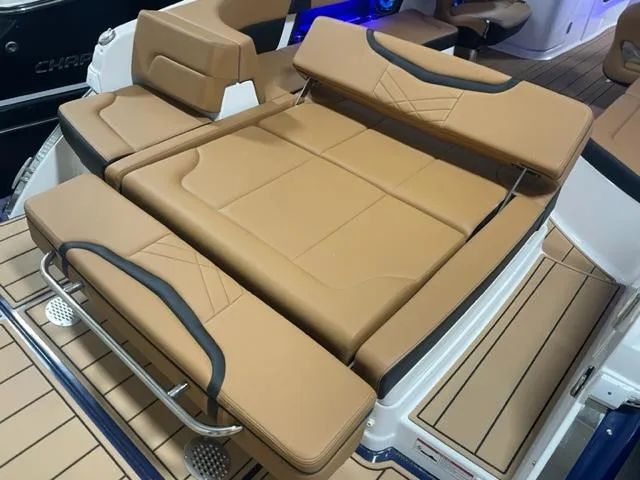 Slide: The Image of 2023 Chaparral 307 SSX boat with tan leather seating and deck. - 17