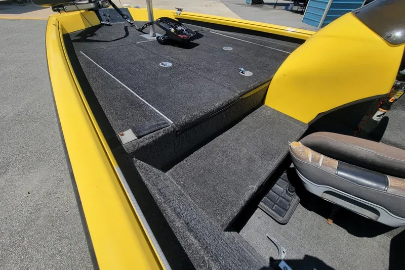 Slide: The Image of Yellow 2011 Excel 1751 F4 boat interior with carpeted deck and seating. - 6