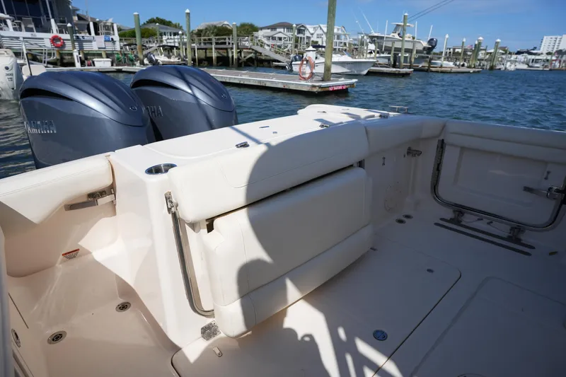 Slide: The Image of 2022 Grady-White Freedom 285 boat with dual Yamaha engines docked at marina. - 12