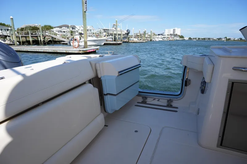 Slide: The Image of 2022 Grady-White Freedom 285 boat interior with open water view. - 14