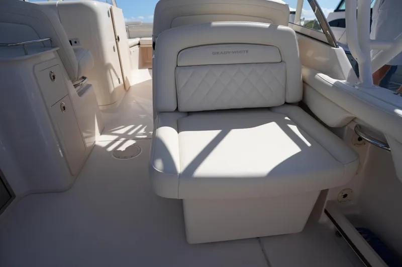 Slide: The Image of 2022 Grady-White Freedom 285 boat interior with luxurious seating and storage. - 16