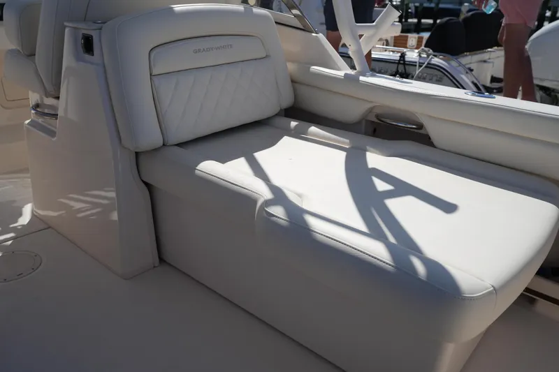 Slide: The Image of Luxurious seating on 2022 Grady-White Freedom 285 boat, featuring elegant white upholstery. - 17