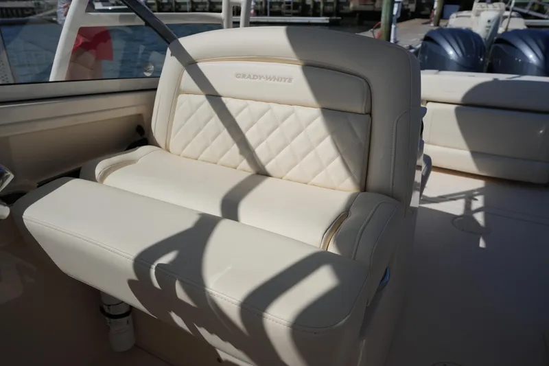 Slide: The Image of Luxurious seating on 2022 Grady-White Freedom 285 boat, featuring elegant diamond stitching. - 20
