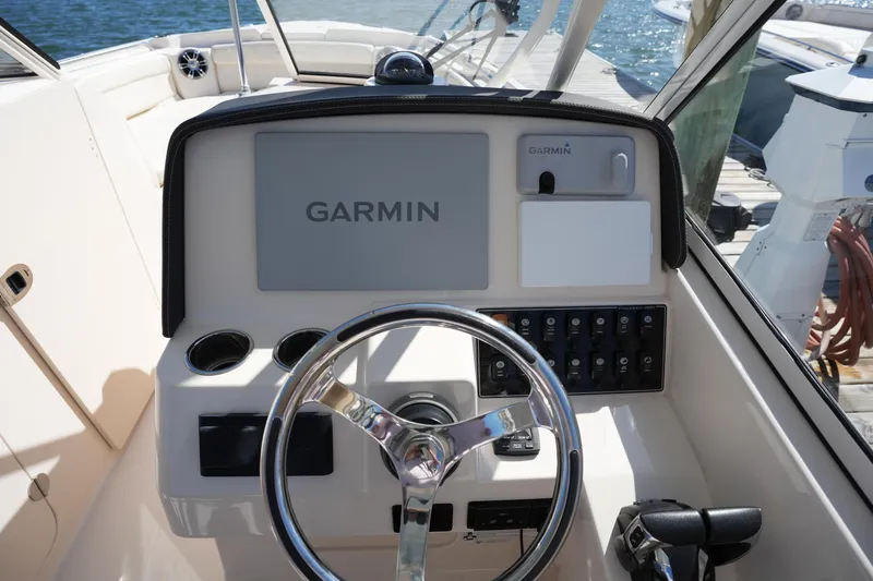 Slide: The Image of 2022 Grady-White Freedom 285 boat helm with Garmin navigation system. - 21