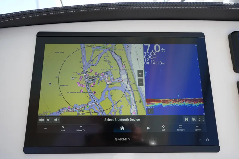 Slide: The Image of Garmin navigation display on 2022 Grady-White Freedom 285 boat, showing map and sonar data. - 23