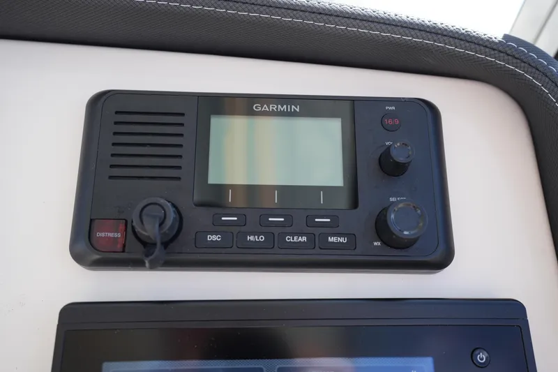 Slide: The Image of Garmin marine radio on 2022 Grady-White Freedom 285 boat dashboard. - 25