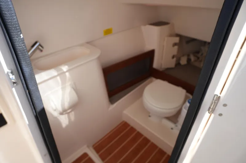 Slide: The Image of 2022 Grady-White Freedom 285 boat bathroom with sink and toilet. - 27