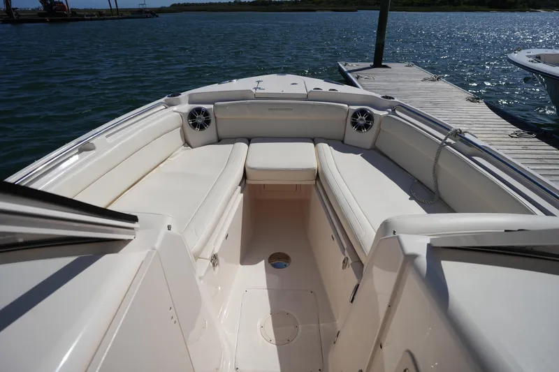 Slide: The Image of 2022 Grady-White Freedom 285 boat interior with spacious seating and waterfront view. - 28