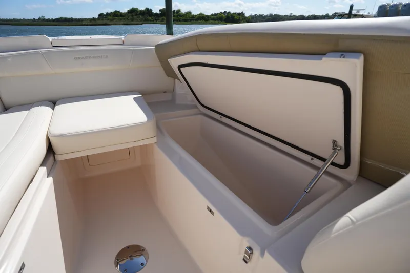 Slide: The Image of 2022 Grady-White Freedom 285 boat interior with open storage compartment. - 29