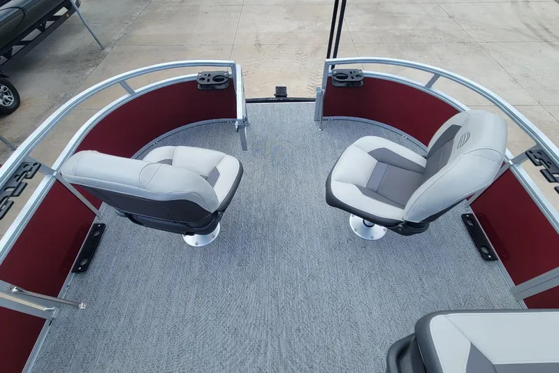 Slide: The Image of 2026 Sun Tracker Bass Buggy 16 XL Select pontoon boat with swivel seats and carpeted deck. - 14