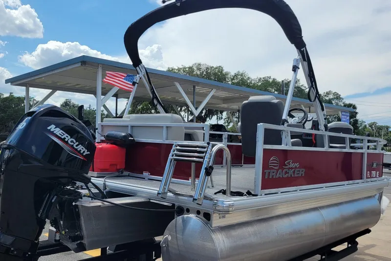 Slide: The Image of 2026 Sun Tracker Bass Buggy 16 XL Select pontoon boat with Mercury engine. - 4