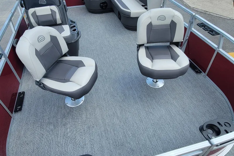 Slide: The Image of 2026 Sun Tracker Bass Buggy 16 XL Select interior with swivel seats and carpeted flooring. - 7
