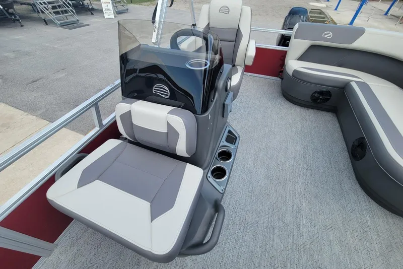 Slide: The Image of 2026 Sun Tracker Bass Buggy 16 XL Select interior with seating and console. - 8