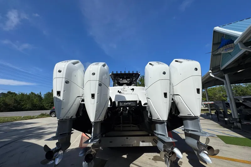 Slide: The Image of Rear view of 2022 Invincible 46 Catamaran with four powerful outboard engines. - 10