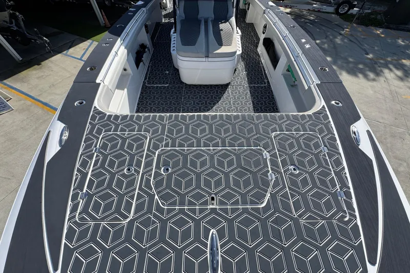 Slide: The Image of 2022 Invincible 46 Catamaran with geometric deck design, docked at marina. - 13