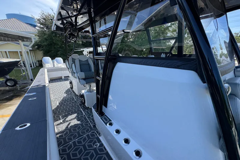 Slide: The Image of 2022 Invincible 46 Catamaran with sleek design, modern seating, and geometric flooring. - 21