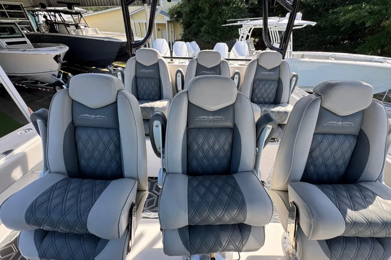 Slide: The Image of Luxurious seating on 2022 Invincible 46 Catamaran, featuring elegant diamond-stitched upholstery. - 25