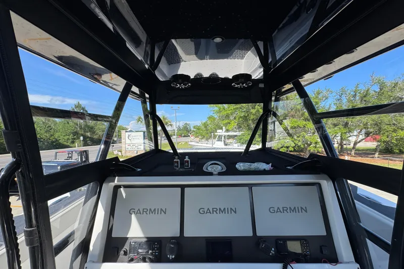 Slide: The Image of Helm of 2022 Invincible 46 Catamaran with Garmin navigation displays and controls. - 31