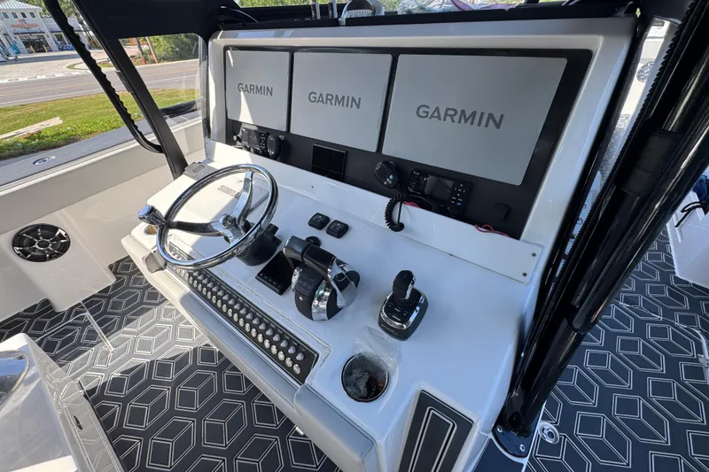 Slide: The Image of Helm of 2022 Invincible 46 Catamaran with Garmin displays and modern controls. - 33