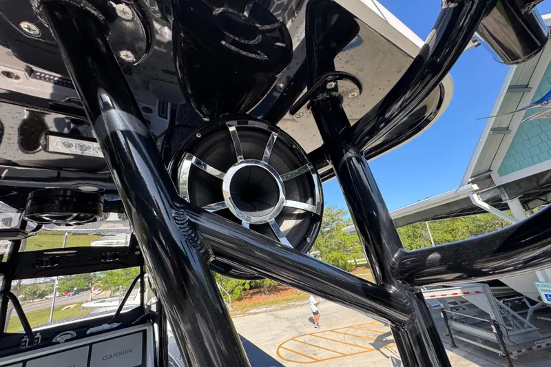Slide: The Image of Close-up of 2022 Invincible 46 Catamaran's sleek black structure and speaker system. - 39