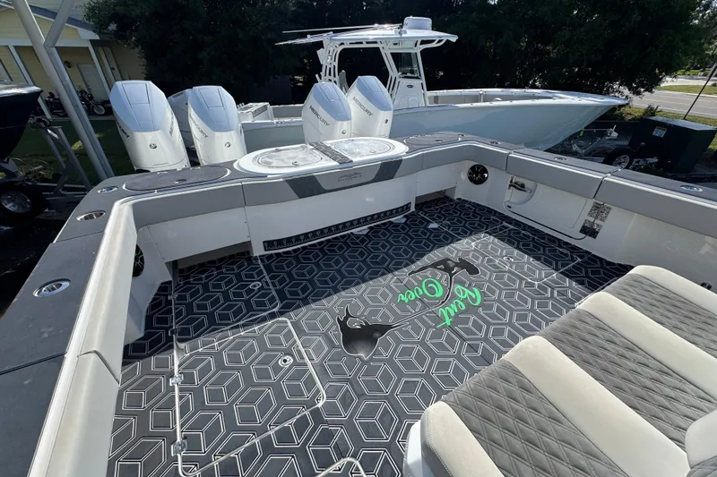 Slide: The Image of 2022 Invincible 46 Catamaran with sleek design, spacious deck, and powerful Mercury engines. - 42