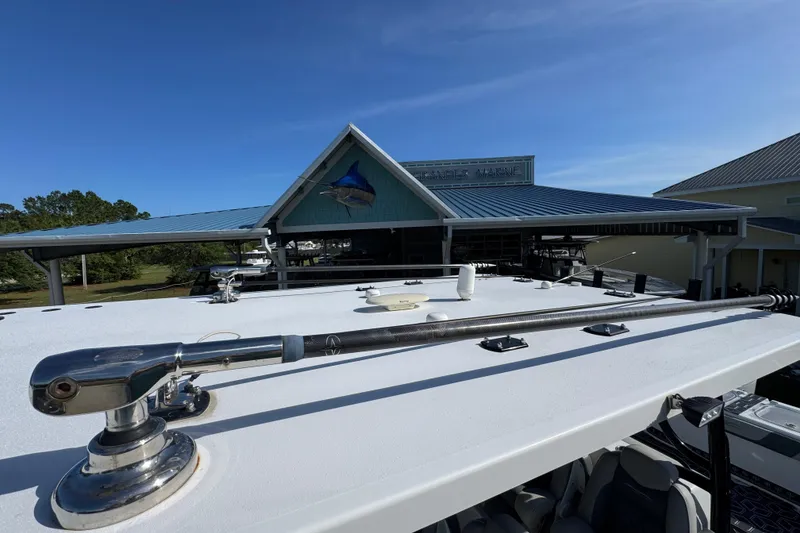 Slide: The Image of Rooftop view of 2022 Invincible 46 Catamaran at a marina with blue sky. - 47