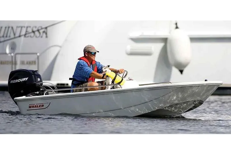 Slide: The Image of Manufacturer Provided Image: 2017 Boston Whaler 110 Sport boat with Mercury outboard motor on water. - 2