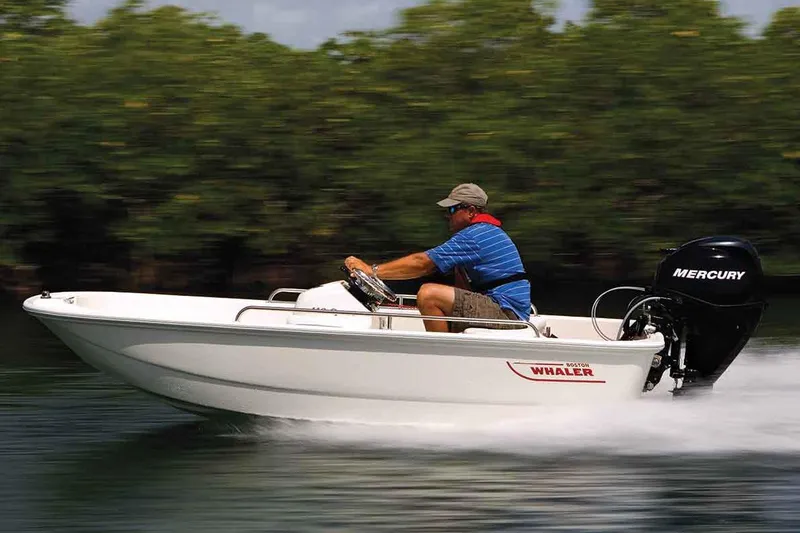 Slide: The Image of Manufacturer Provided Image: 2017 Boston Whaler 110 Sport boat speeding on water with Mercury outboard motor. - 3