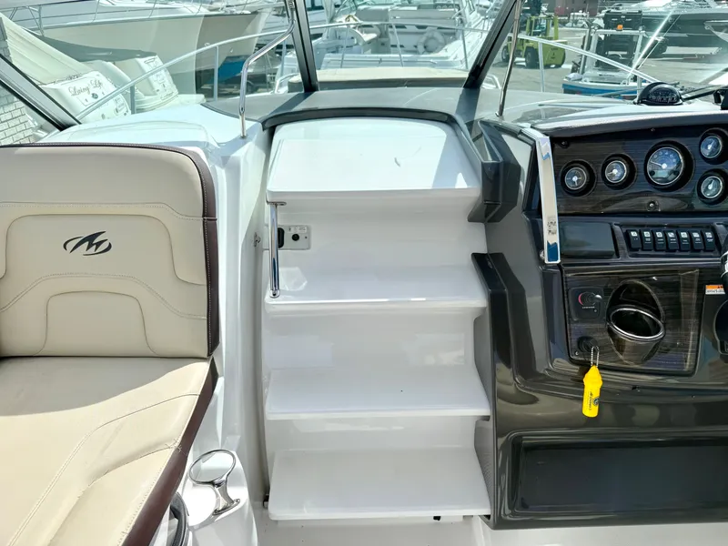Slide: The Image of Interior of a 2019 Monterey SPORT YACHT 295 with helm console. - 13