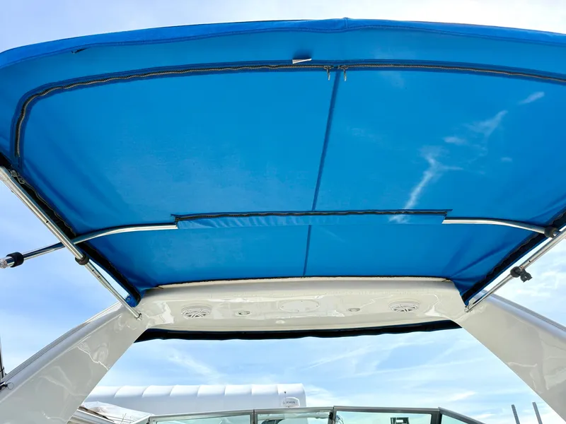 Slide: The Image of Blue canopy of the 2019 Monterey SPORT YACHT 295. - 21