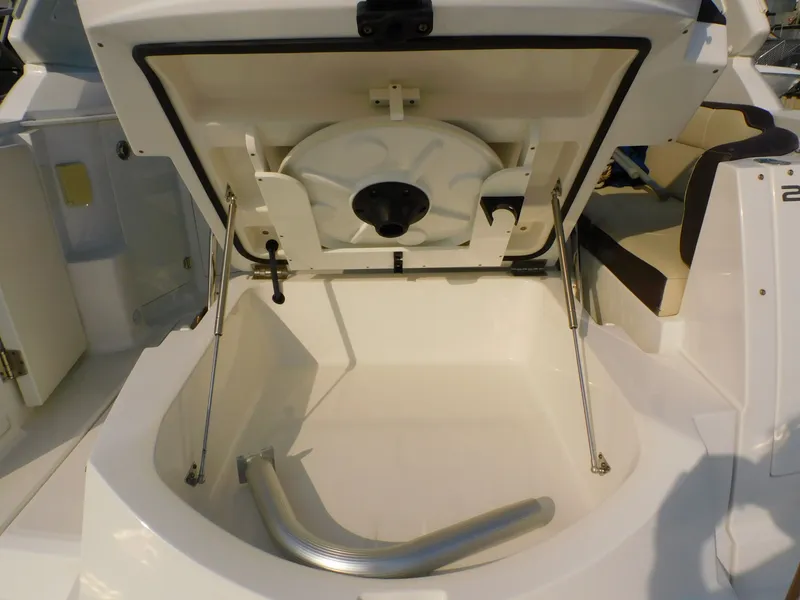 Slide: The Image of 2019 Monterey SPORT YACHT 295 storage compartment open. - 23