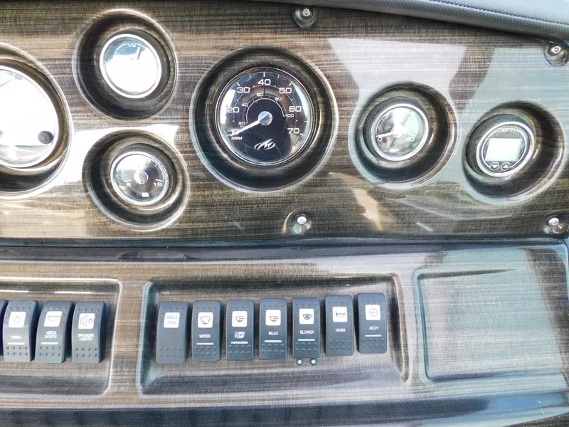 Slide: The Image of Dashboard of 2019 Monterey SPORT YACHT 295 with gauges and switches. - 30